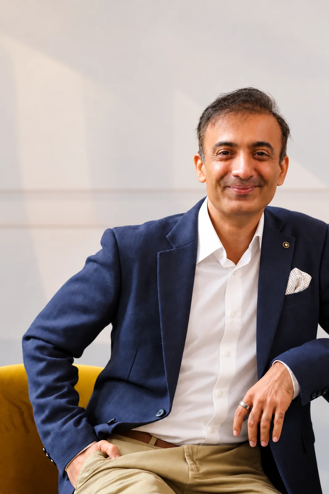 Rai Shahnawaz seated, smiling